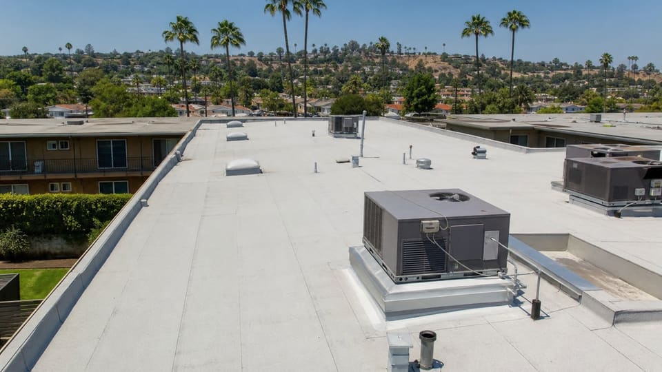 Flat commercial roof on a multi-unit business building